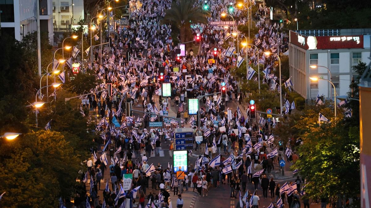 Demonstrators rally to protest the Israeli government's judicial overhaul bill in Tel Aviv. Credit: AFP Photo