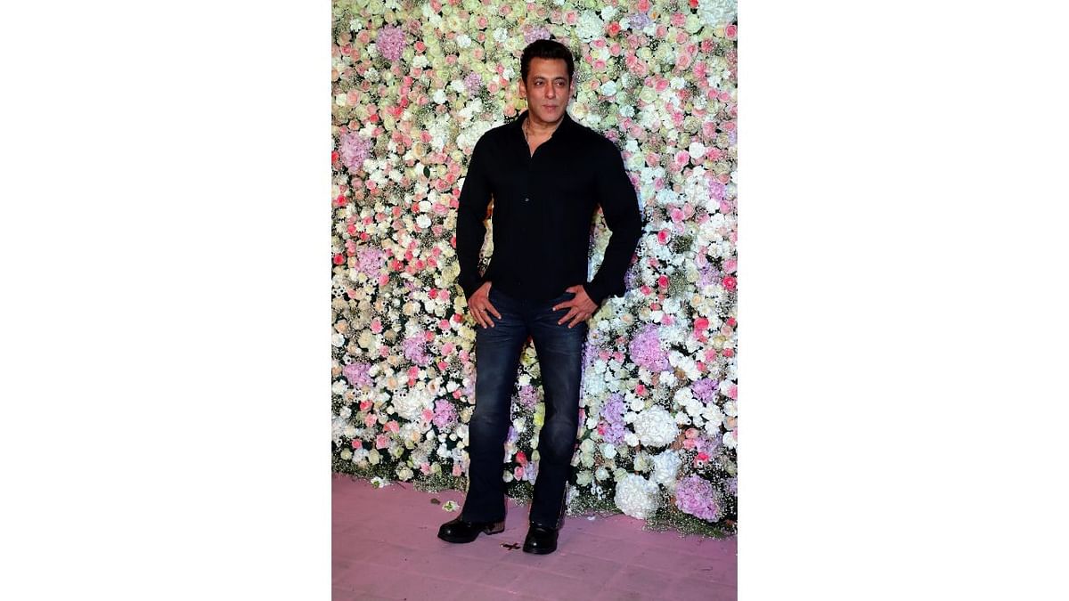 Salman Khan chose a minimalistic look as he looked dapper in a sleek black shirt paired with blue jeans. Credit: PTI Photo