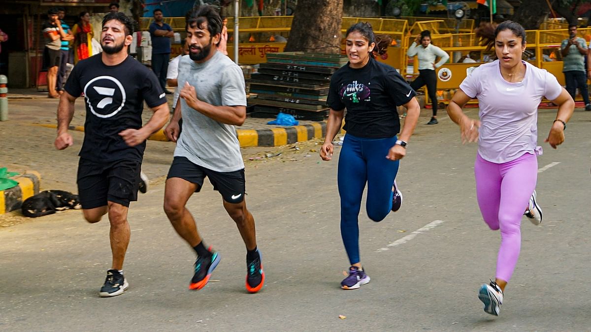 On Day 4 of the protest, the grapplers were seen working out. Vinesh was training with Sangita Phogat, whereas Sakshi was helped by her husband Satyawart Kadian, the Arjuna awardee wrestler. Credit: PTI Photo