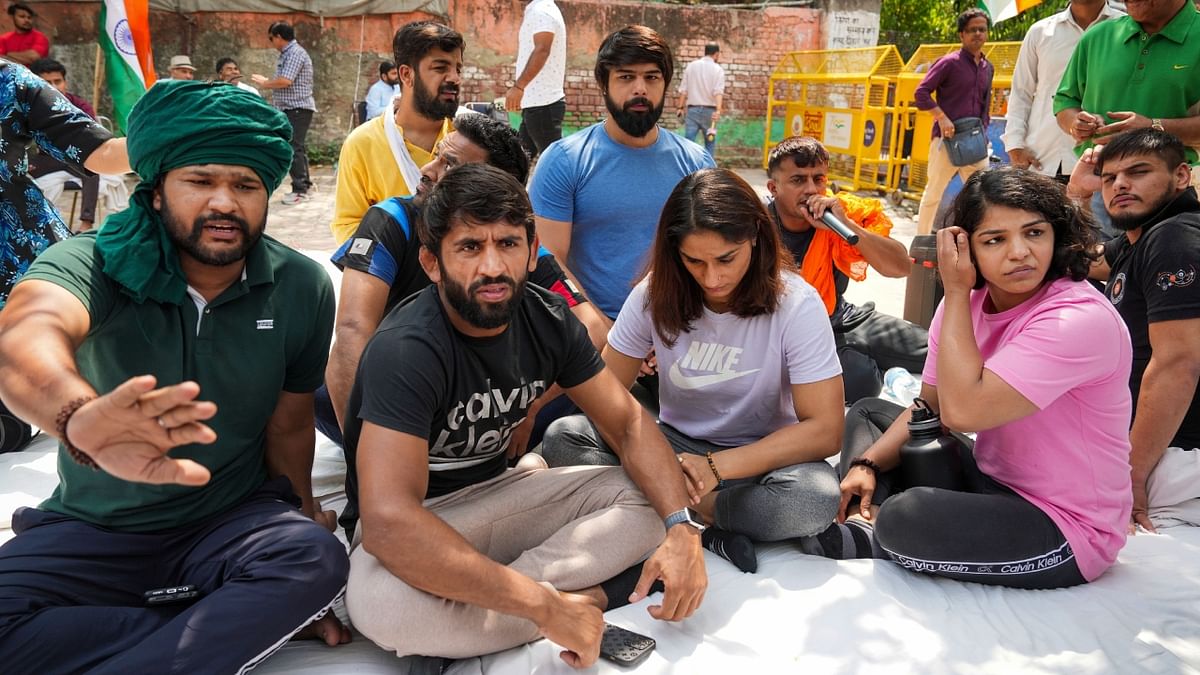 Amid the ongoing protests by wrestlers against chief of the Wrestling Federation of India (WFI) Brij Bhushan Sharan Singh, the protest area donned the look of a training centre as the wrestlers were seen carrying out their daily fitness routine like stretching, running and workout. Credit: PTI Photo
