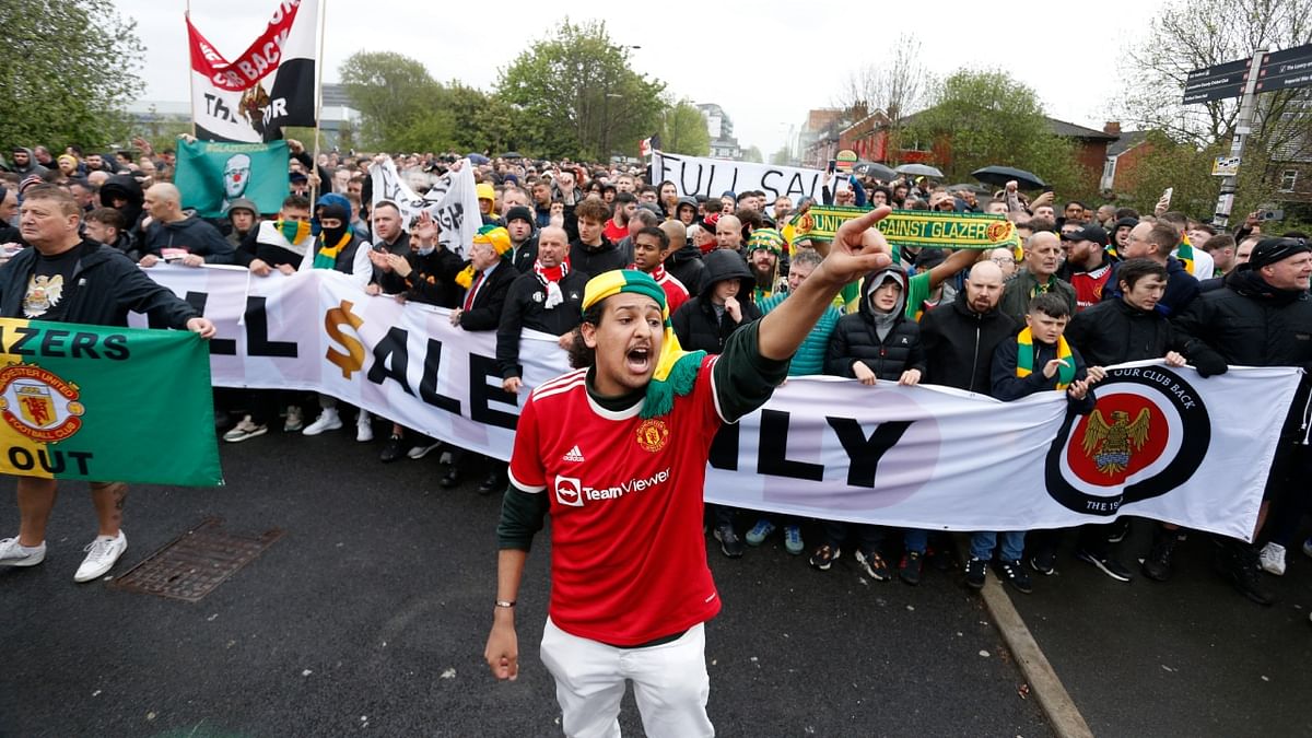 A large group held up a banner that read “Full Sale Only” amid fears the owners may yet retain a majority or minority stake, despite inviting offers for their shares after announcing plans to “explore strategic alternatives” in November. Credit: Reuters Photo