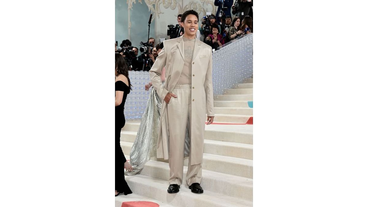 Brittney Griner wore a warm stone shade in a suit with a long jacket by Calvin Klein. Credit: AFP Photo