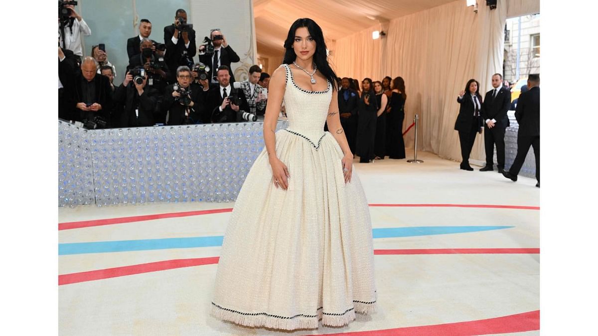 Dua Lipa walked in a white Chanel ballgown from the fashion house's archive and Nicole Kidman chose a look Lagerfeld himself made for her 20 years ago. Credit: AFP Photo