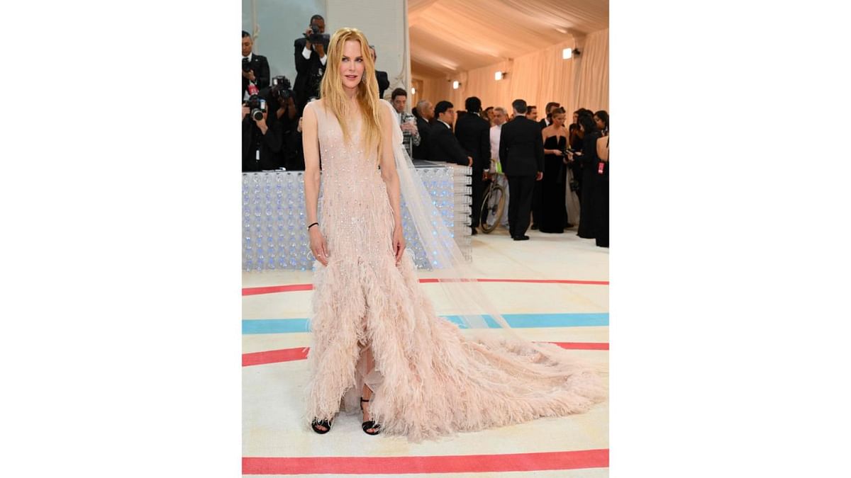 Nicole Kidman wore a pale pink gown created by Lagerfeld for a Chanel No. 5 commercial she starred in. It's adorned with 3,000 silver crystals for the ad directed by Baz Luhrmann. Credit: AFP Photo