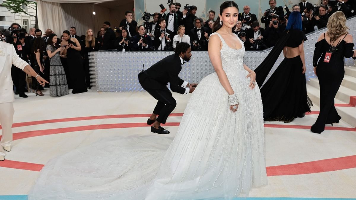 For her debut appearance, Alia Bhatt wore an ivory ball gown by Prabal Gurung which was embellished with 100,000 pearls hand beaded in India. It was inspired by Claudia Schiffer's iconic dress. Credit: AFP Photo