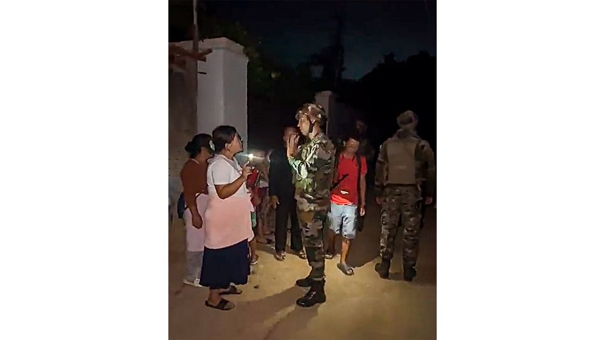 Indian Army and Assam Rifles personnel rescue civilians from violence-hit areas, in Manipur. Credit: Twitter/@prodefkohima