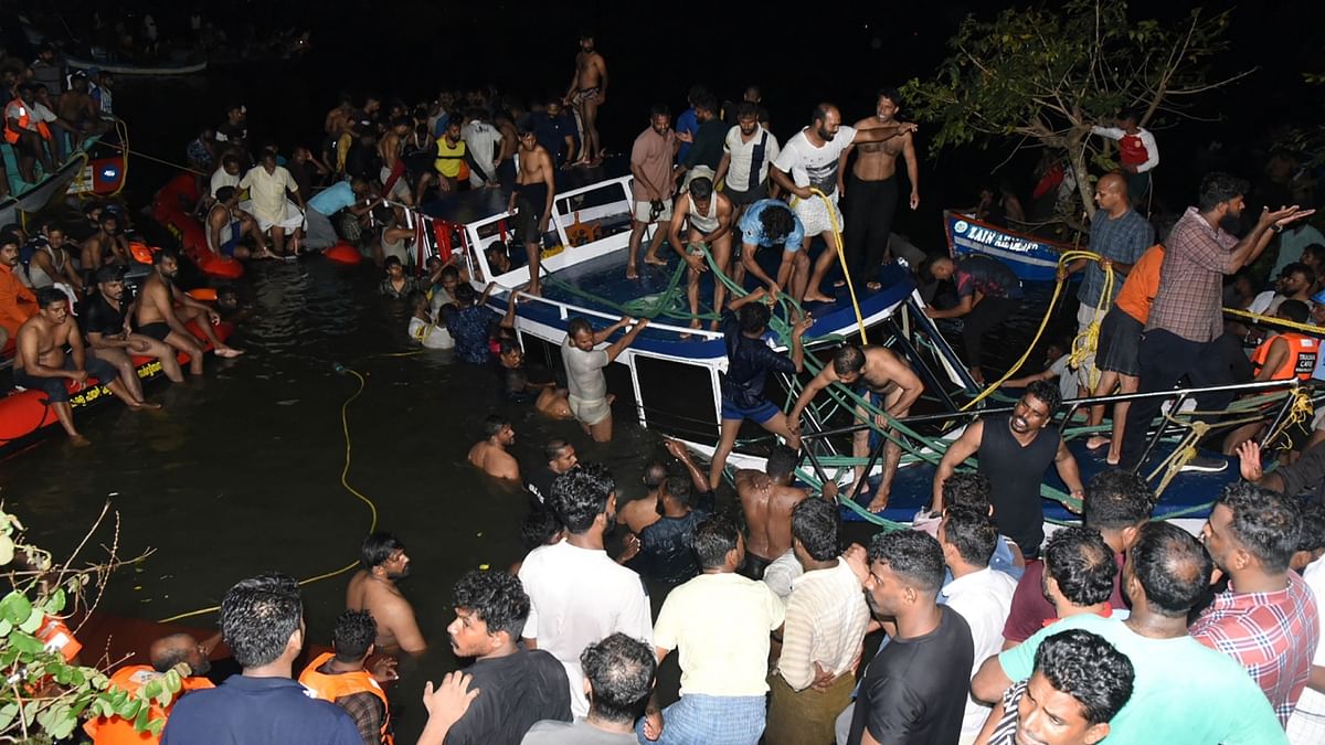 Twenty-two people, including women and children, were killed when a  tourist boat with more than 30 passengers on board capsized and sank in Kerala. Credit: AFP Photo