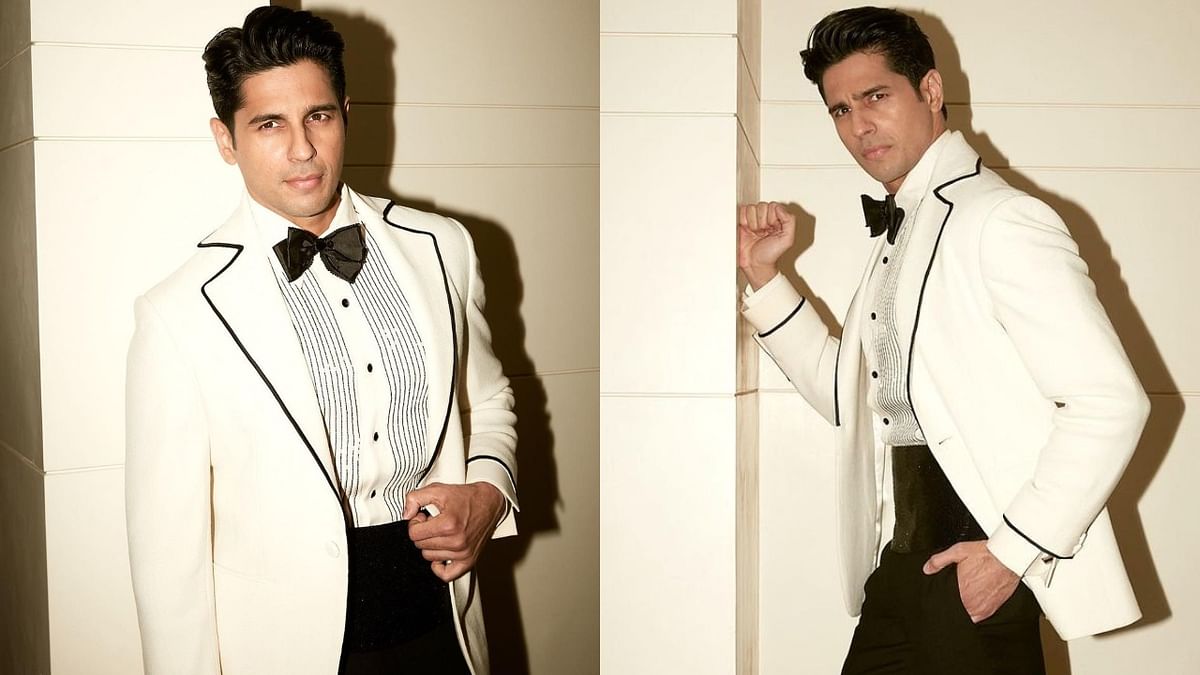 Sidharth Malhotra looked dapper in a Shahab Durazi white tuxedo. He accessorized the look with a polished bow tie and a silk cummerbund underneath the jacket. Credit: Instagram/@sidmalhotra