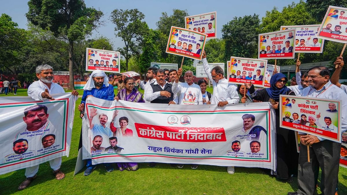 Congress workers chant slogans at the AICC headquarters on the counting day of Karnataka Assembly polls, in New Delhi. Credit: PTI Photo