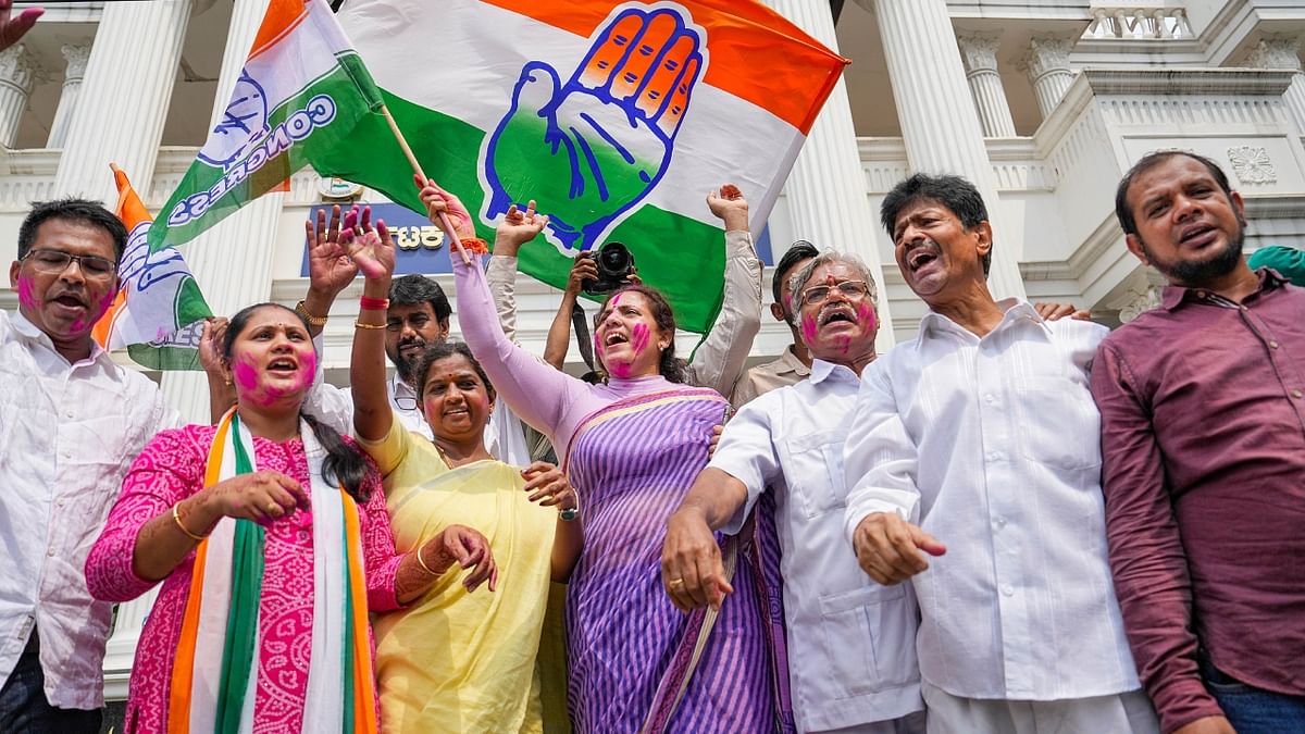The Congress party offices in Bengaluru and New Delhi wore a festive look with party workers celebrating the poll results. Credit: PTI Photo