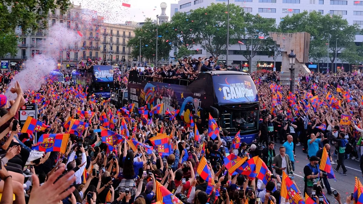 Thousands of supporters took to the streets of Barcelona to celebrate the club's Spanish league title triumphs of the men's and women's squads. Credit: Reuters Photo
