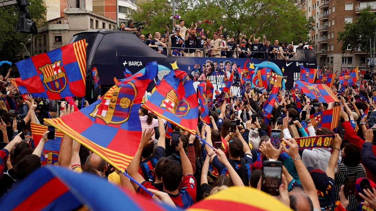 FC Barcelona's Andreas Christensen and teammates celebrate with fans during the victory parade. Credit: Reuters Photo