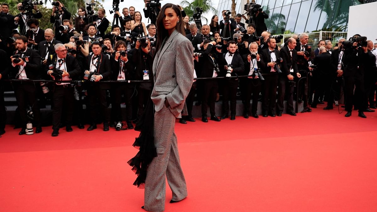 French model Cindy Bruna looked stunning in an oversized glen check suit with ruffle detail paired with Pomellato necklace. Credit: AFP Photo