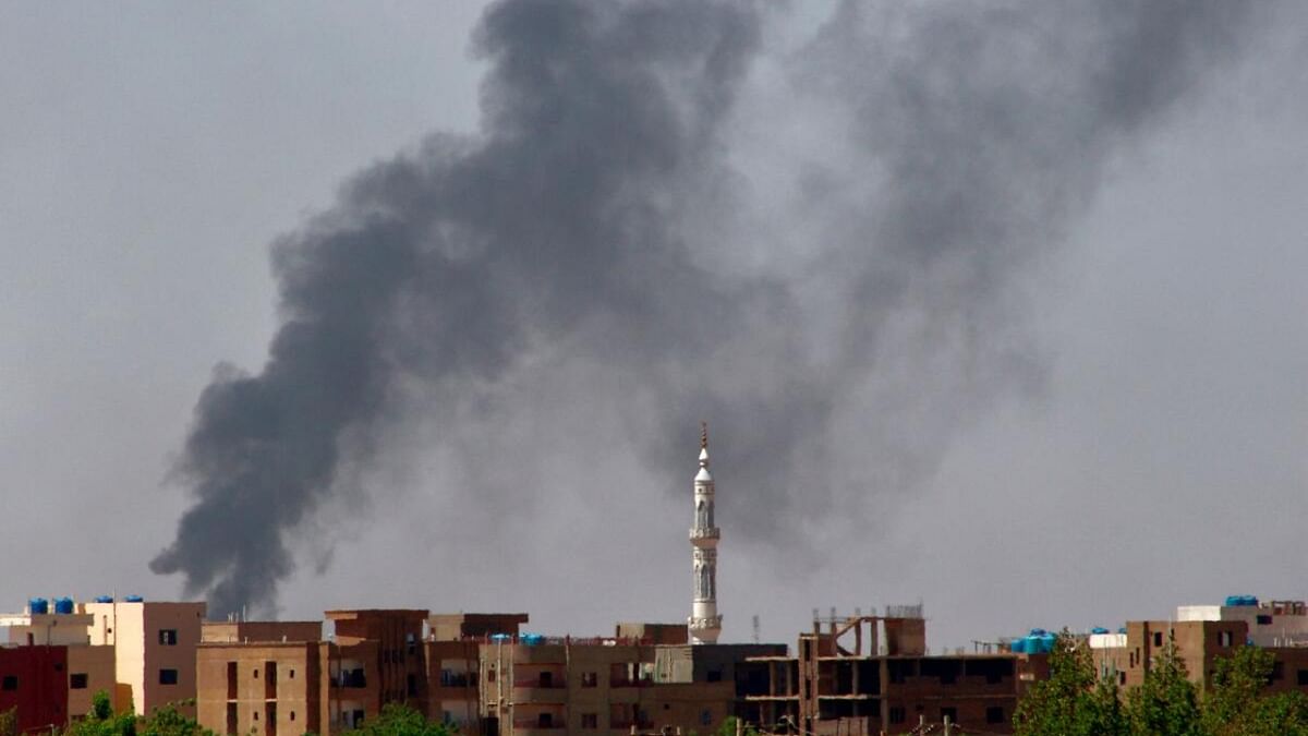 Smoke billows in Khartoum on May 17, 2023, as clashes continue in war-torn Sudan. Khartoum was again rocked by battles today more than a month into a brutal war that has made