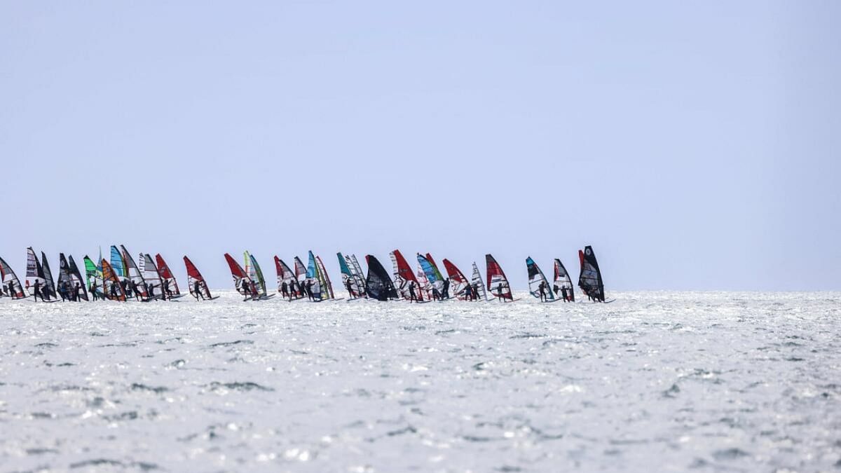 Some 1200 windsurfers take the start of the 21th edition of the Defi Wind in the Mediterranean Sea, off the coast of Gruissan in southern France, on May 19, 2023. Credit: AFP Photo