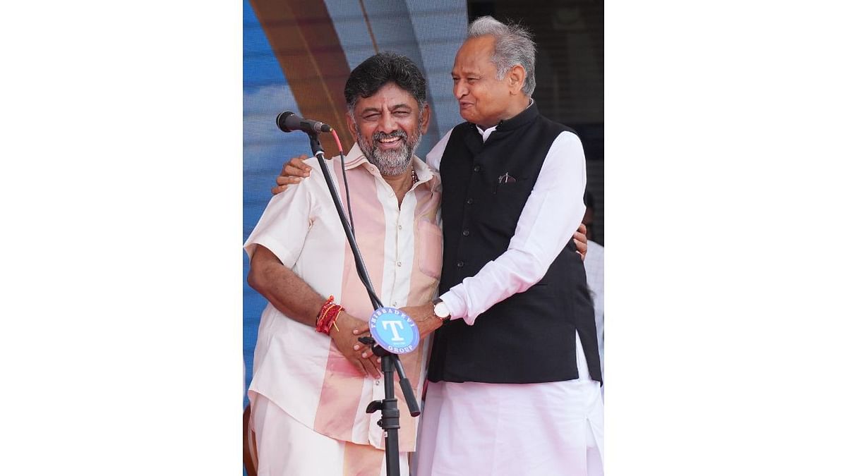 Newly-appointed Karnataka deputy Chief Minister DK Shivakumar with Rajasthan Chief Minister Ashok Gehlot during the swearing-in ceremony of Congress government at Kanteerava Stadium, in Bengaluru. Credit: PTI Photo