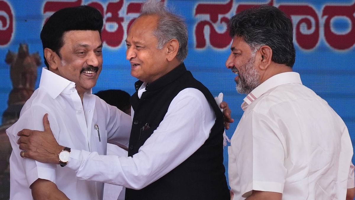 Rajasthan CM Ashok Gehlot greets Tamil Nadu CM MK Stalin as newly-elected Karnataka deputy CM D K Shivakumar looks on during the swearing-in ceremony of Congress govt. Credit: PTI Photo