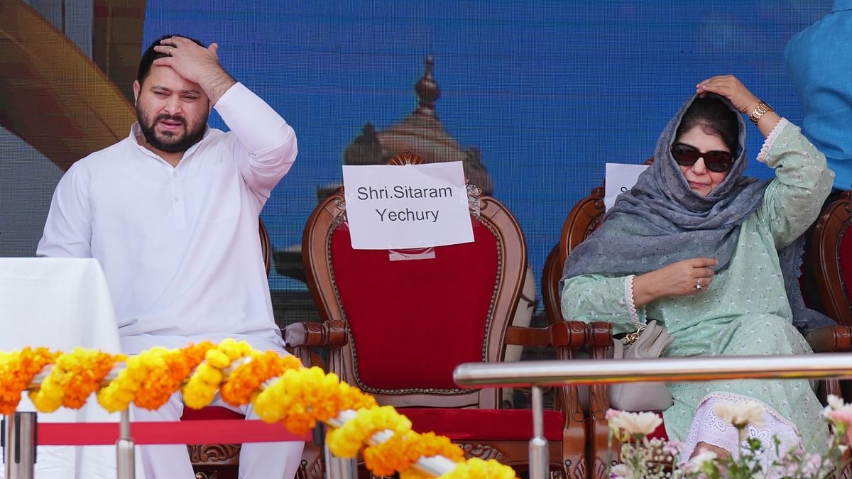 Bihar deputy Chief Minister Tejashwi Yadav and PDP Chief Mehbooba Mufti during the swearing-in ceremony. Credit: PTI Photo