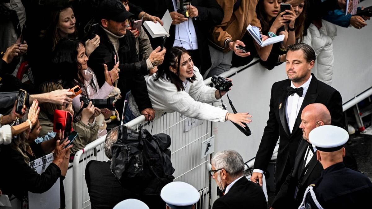 US actor Leonardo Dicaprio greets members of the public as he arrives for the screening of the film