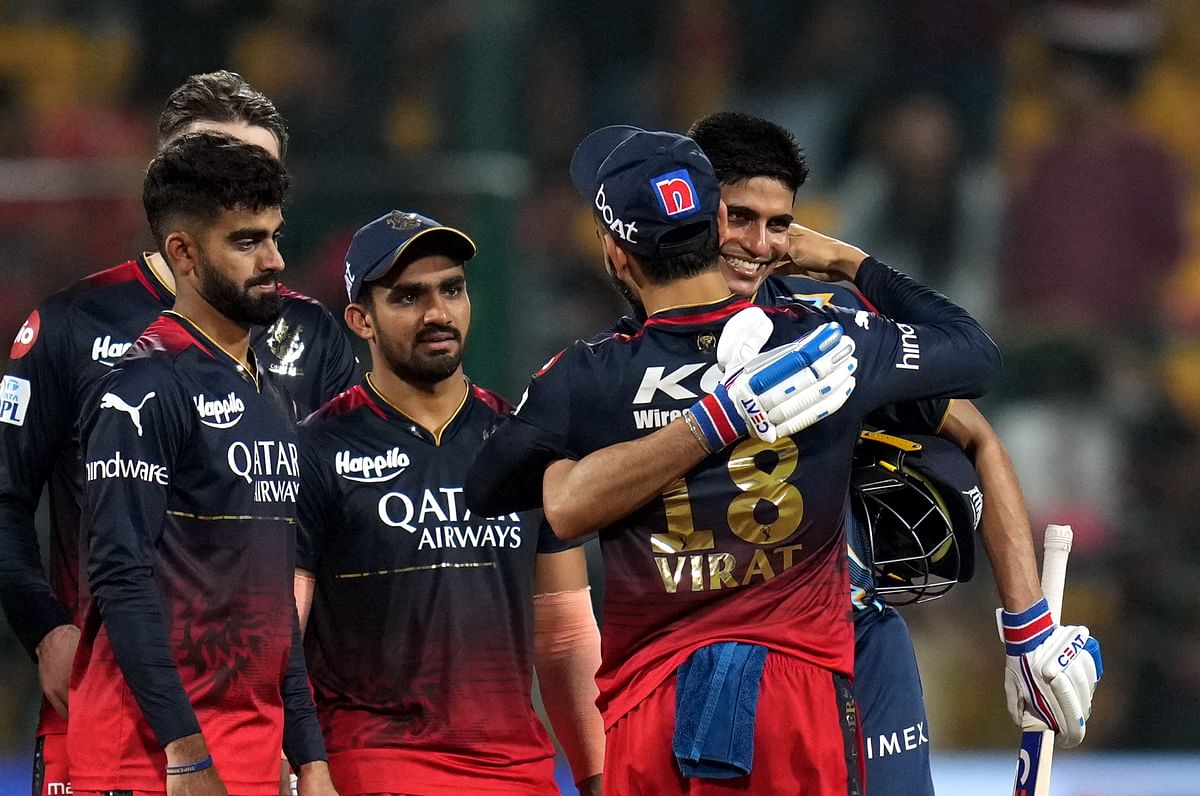 Royal Challengers Bangalore player Virat Kohli greets Gujrat Titans batter Shubman Gill during the IPL 2023 match between Royal Challengers Bangalore and Gujrat Titans at M Chinnaswamy Stadium. Credit: PTI Photo