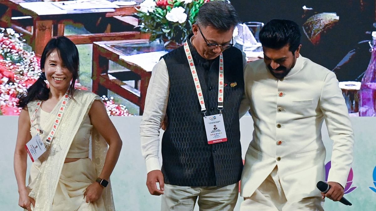 Chang Jae-bok, Korean Ambassador to India is seen matching steps with actor Ram Charan on Oscar-winning song 'Naatu Naatu' as they attend G20 tourism meeting in Srinagar. Credit: AFP Photo