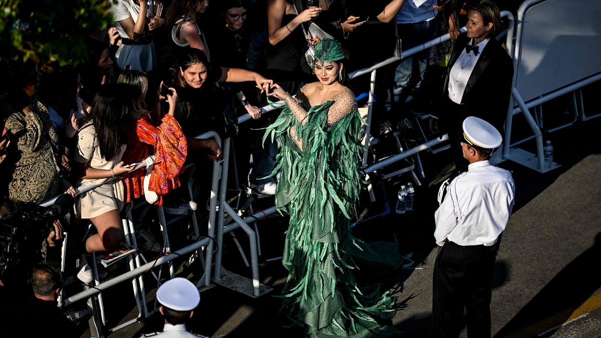 Urvashi interacts with her fans on her arrival for the screening of the film 'Club Zero' during the 76th edition of the Cannes Film Festival. Credit: AFP Photo