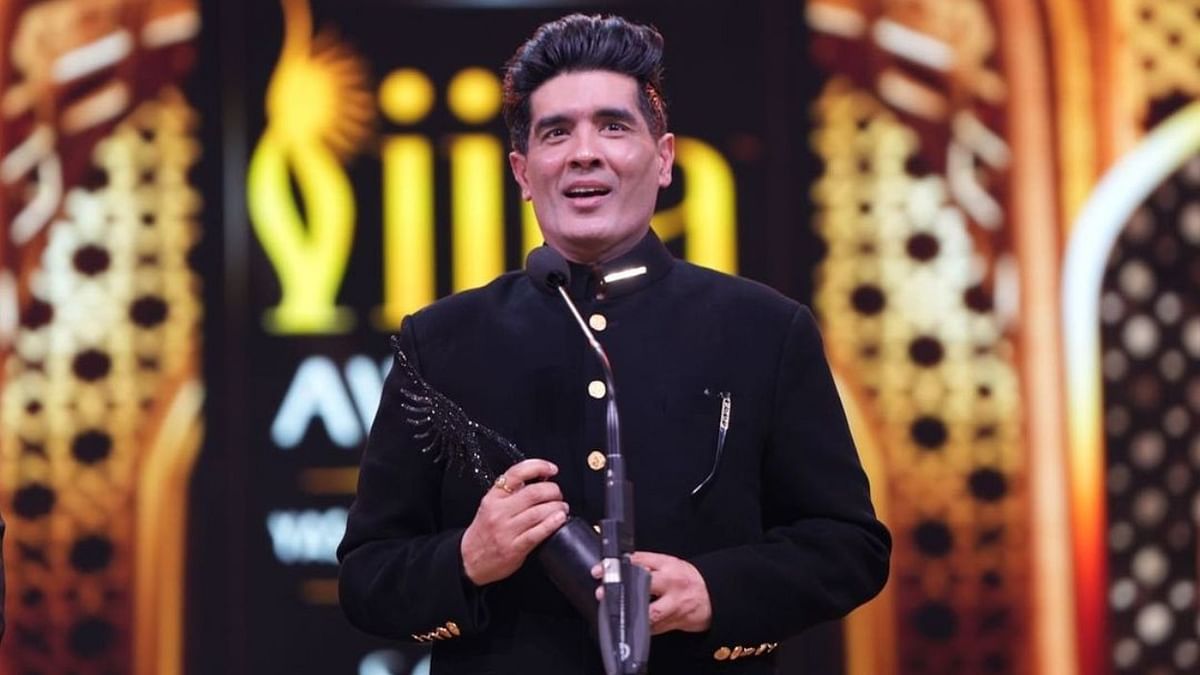 Designer Manish Malhotra, who showcased a special collection on the theme of ‘old world charm meets the new world’ at the IIFA Rocks, was honoured with Outstanding Achievement for Fashion in Cinema. Credit: IIFA