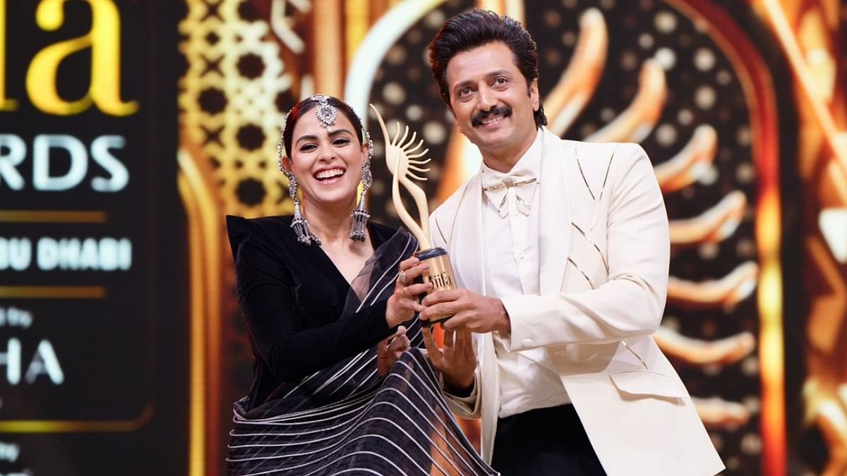 Genelia and Riteish Deshmukh accepted the 'Outstanding Achievement in Regional Cinema' for the movie 'Ved' at IIFA Awards 2023. Credit: IIFA