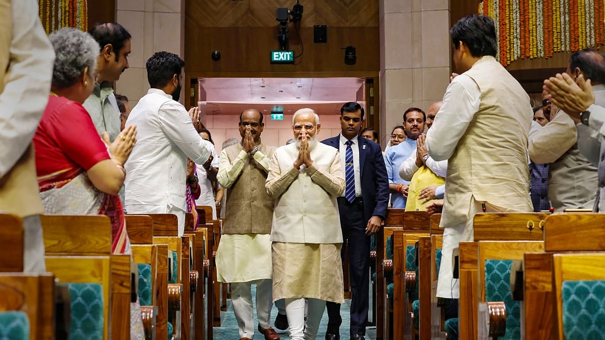Prime Minister Narendra Modi being welcomed as he arrives in the Lok Sabha chamber of the new Parliament building, in New Delhi. Credit: PTI Photo