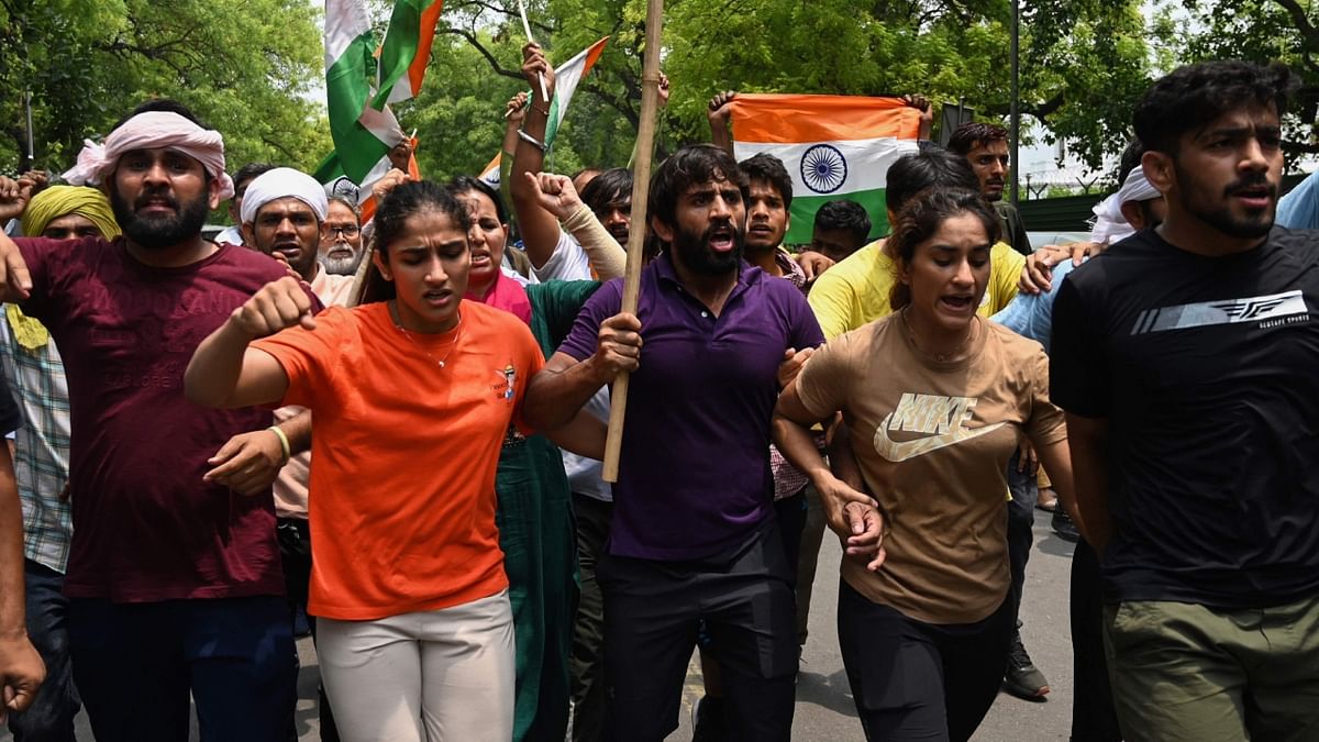 Wrestlers Vinesh Phogat, Sakshi Malik and Bajrang Punia were detained along with their supporters on Sunday when they tried to march to the new Parliament building as it was being inaugurated, with Delhi Police clearing their protest site at Jantar Mantar and saying they will not be allowed to continue their sit-in. Credit: AFP Photo