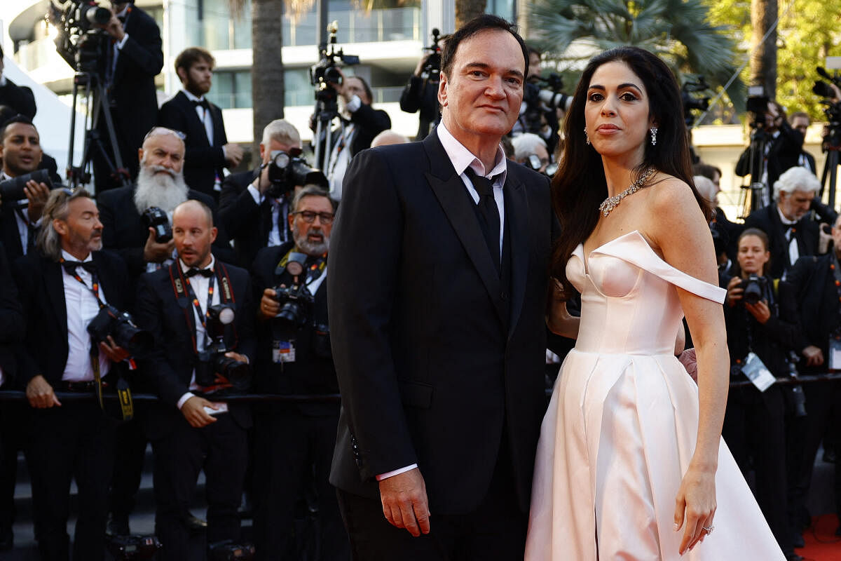 Quentin Tarantino and his wife Daniella Pick pose on the red carpet to attend the closing ceremony and the screening of the animated film