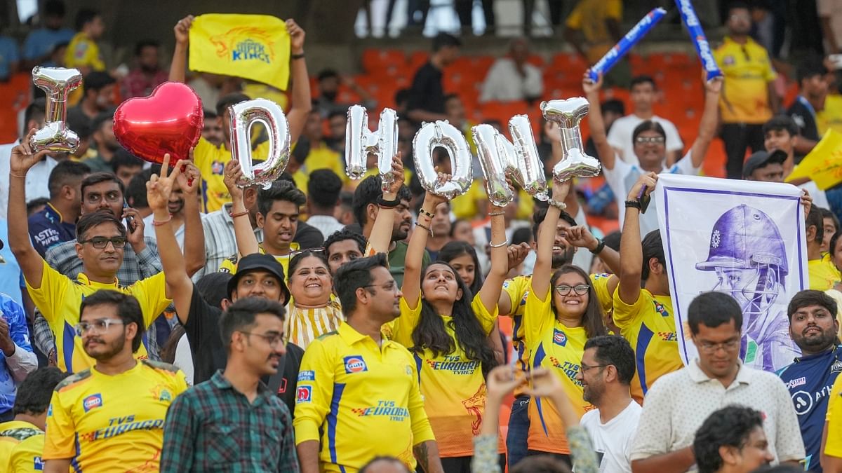 Fans cheer before the start of the IPL 2023 cricket match between Gujarat Titans and Chennai Super Kings, at the Narendra Modi Stadium in Ahmedabad. Credit: PTI Photo