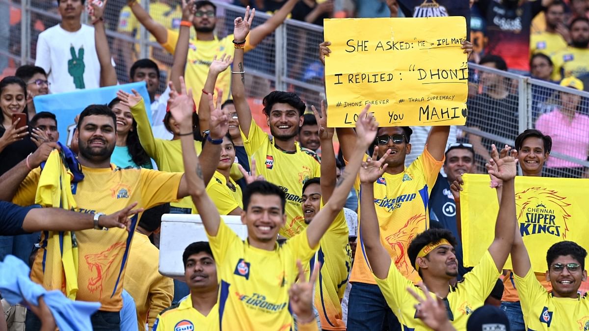 Chennai Super Kings' fans cheer before the start of the Indian Premier League (IPL) Twenty20 final cricket match between Gujarat Titans and Chennai Super Kings at the Narendra Modi Stadium in Ahmedabad. Credit: AFP Photo