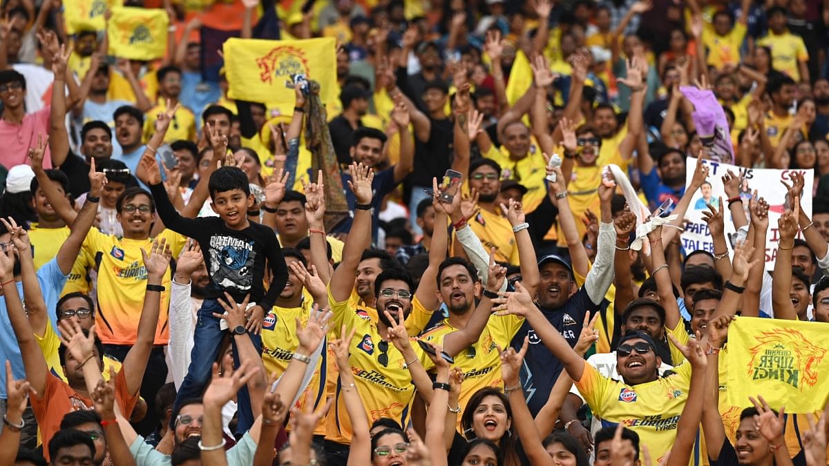 Chennai Super Kings' fans cheer as they enjoy the Indian Premier League (IPL) Twenty20 final cricket match between Gujarat Titans and Chennai Super Kings at the Narendra Modi Stadium in Ahmedabad. Credit: AFP Photo