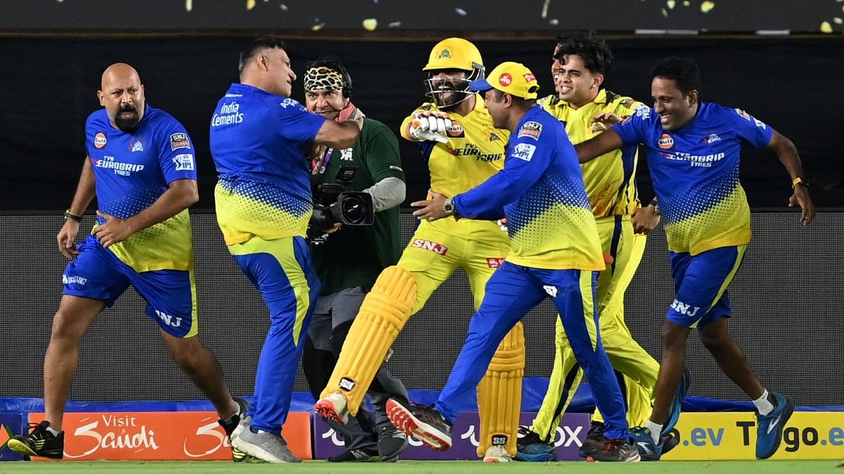 Chennai Super Kings' members celebrate their win at the end of the Indian Premier League (IPL) Twenty20 final cricket match between Gujarat Titans and Chennai Super Kings at the Narendra Modi Stadium in Ahmedabad. Credit: AFP Photo
