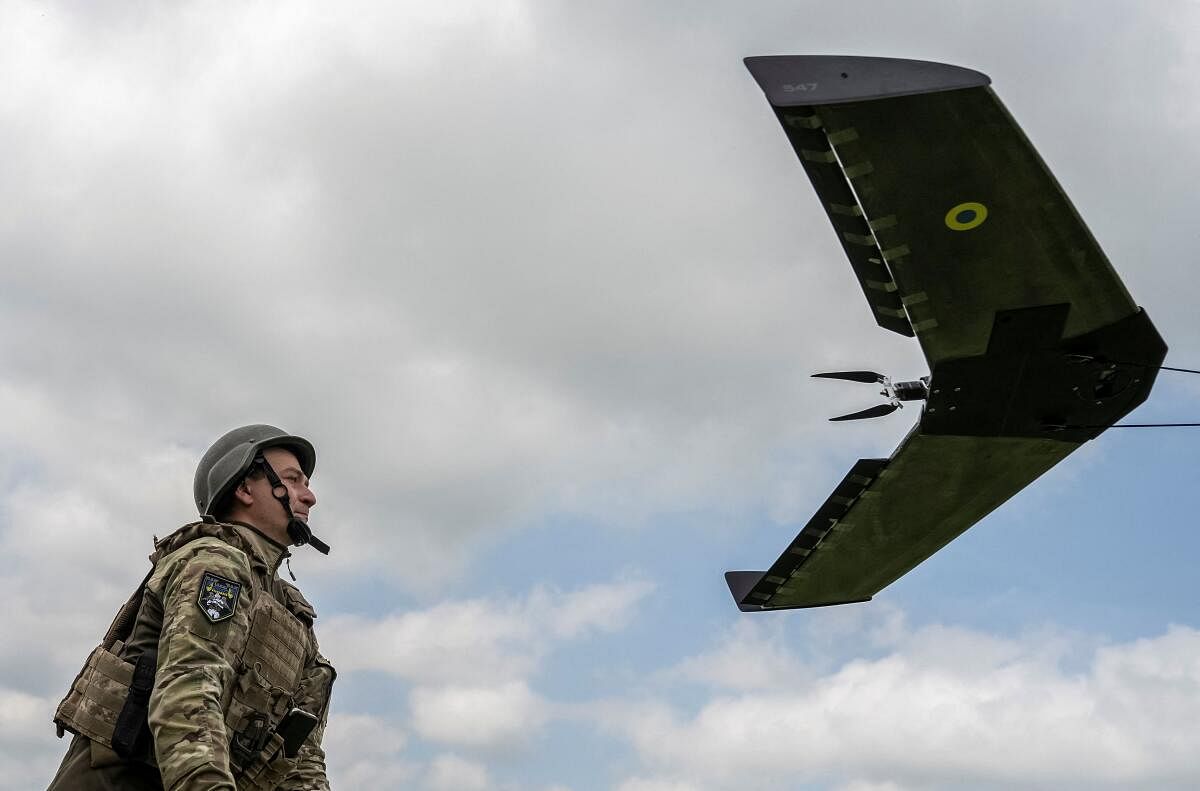 A Ukrainian serviceman prepares to launch a reconnaissance unmanned aerial device near a frontline in Donetsk region. Credit: Reuters Photo