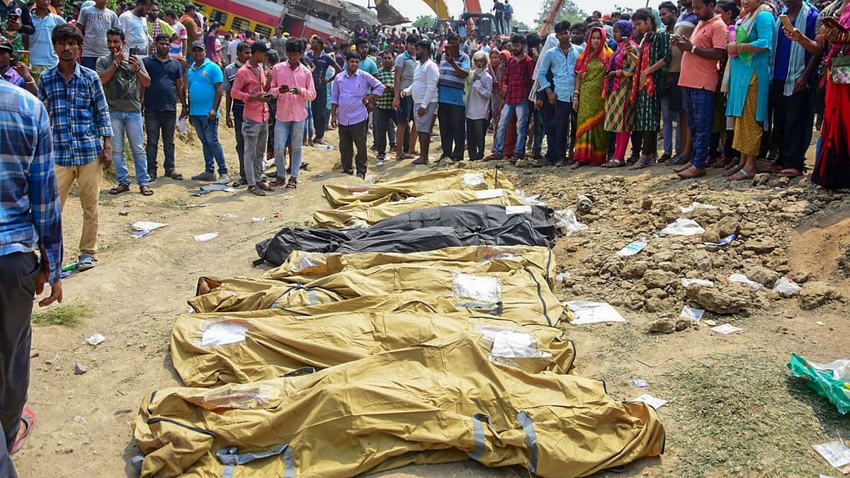 Closer to the ground, bloodied and disfigured bodies lay enmeshed with each other, creating a grotesque sight. Credit: PTI Photo
