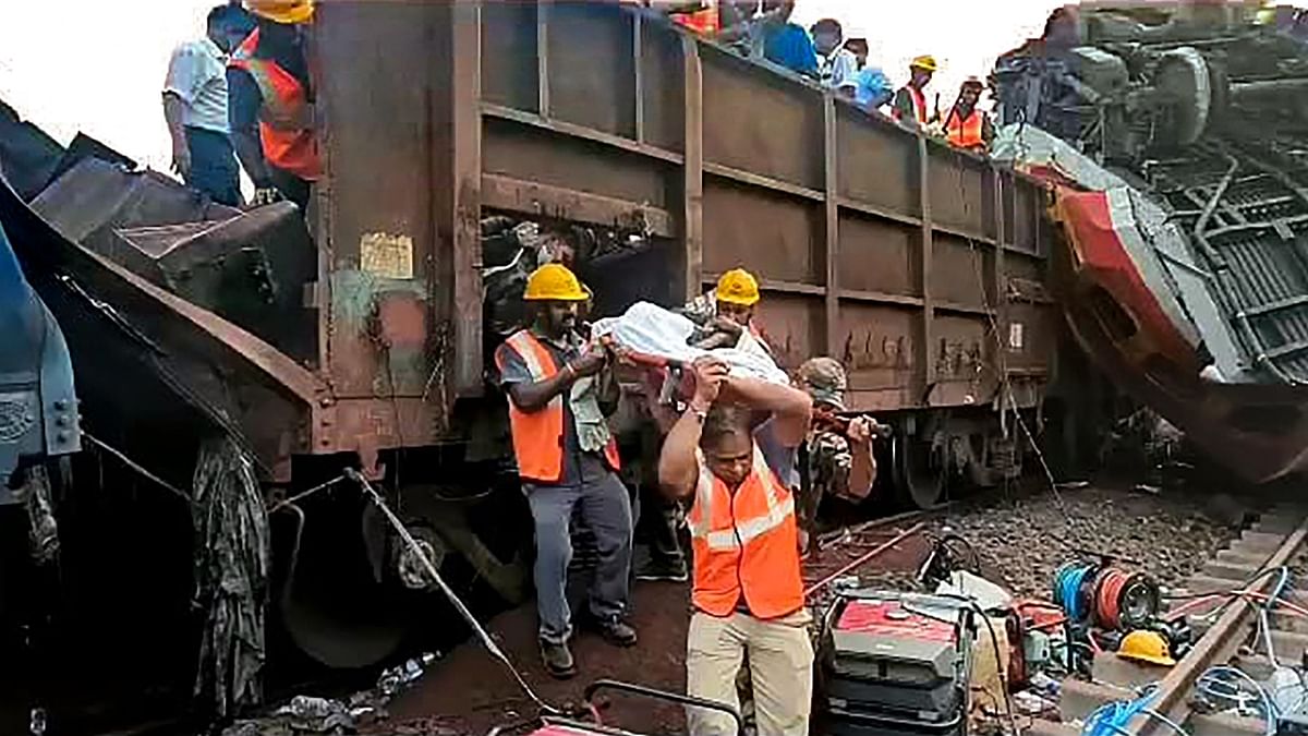An injured being rescued following an accident involving Coromandel Express, Bengaluru-Howrah Express and a goods train, in Balasore, Odisha. Credit: PTI Photo