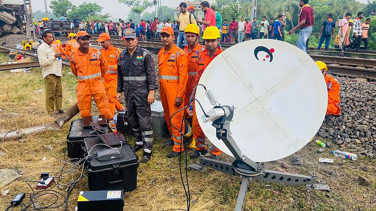 NDRF personnel during the search and rescue operation at the site where Coromandel Express, Bengaluru-Howrah Express and a goods train derailed, in Balasore. Credit: PTI Photo