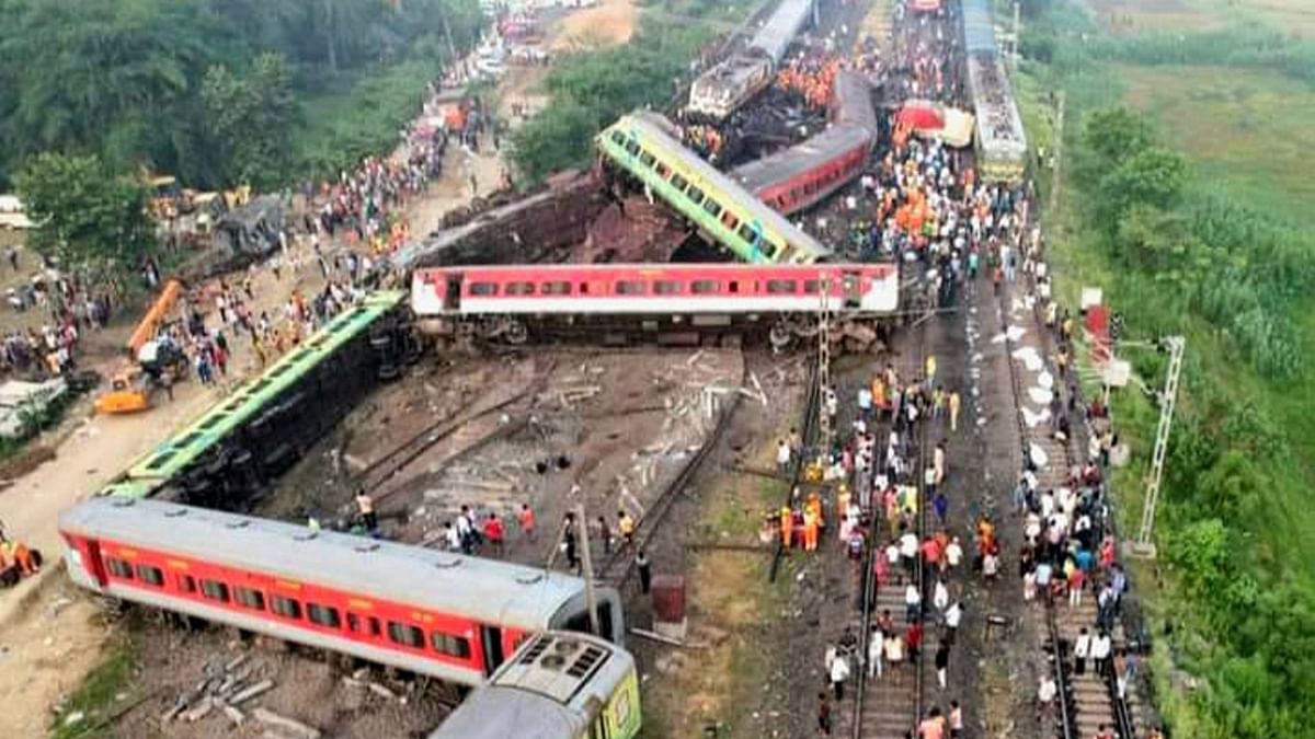 Large cranes and bulldozers tried to lift the last remaining coach amid the strewn and mangled wreckage of three trains that rammed into each other in rapid sequence in Odisha's Balasore district. Credit: PTI Photo