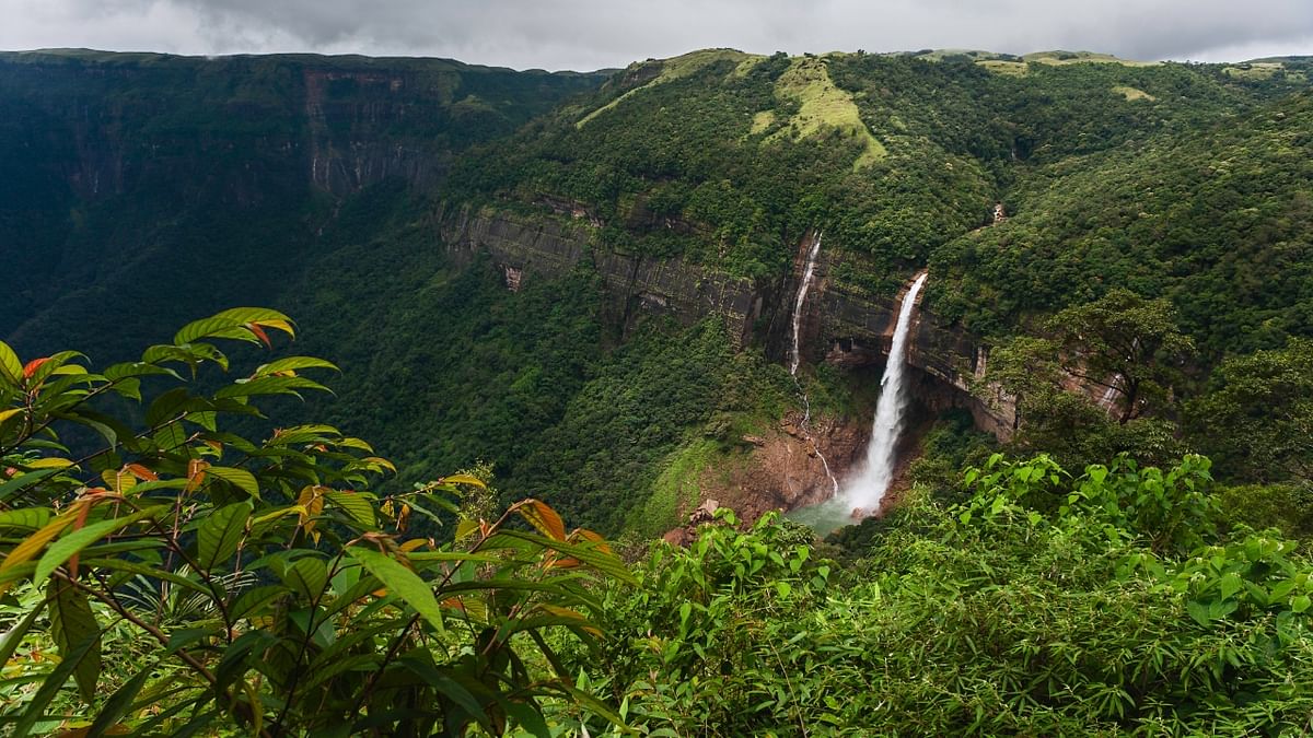 Cherrapunji, Meghalaya: Known as one of the wettest places on the planet, Cherrapunji receives heavy rainfall during the monsoon season. The region's lush green landscapes, living root bridges, and numerous waterfalls make it a unique destination to experience the monsoon. Credit: Getty Images