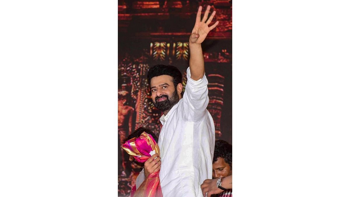 Prabhas is seen waving towards the sea of his fans in Tirupati. Credit: PTI Photo