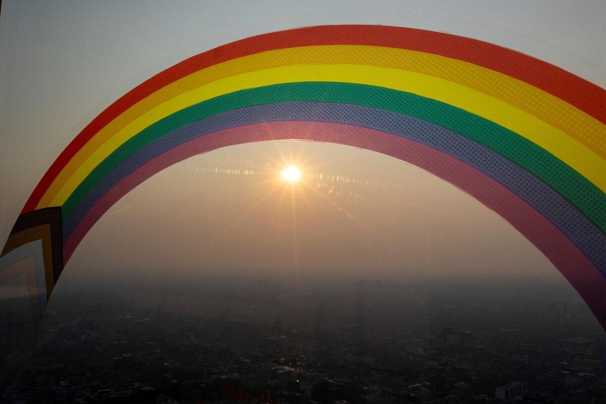 A rainbow sticker marking PRIDE month is seen as a smokey Toronto is seen from the CN Tower as wildfires in Ontario and Quebec continue to burn. Credit: Reuters Photo
