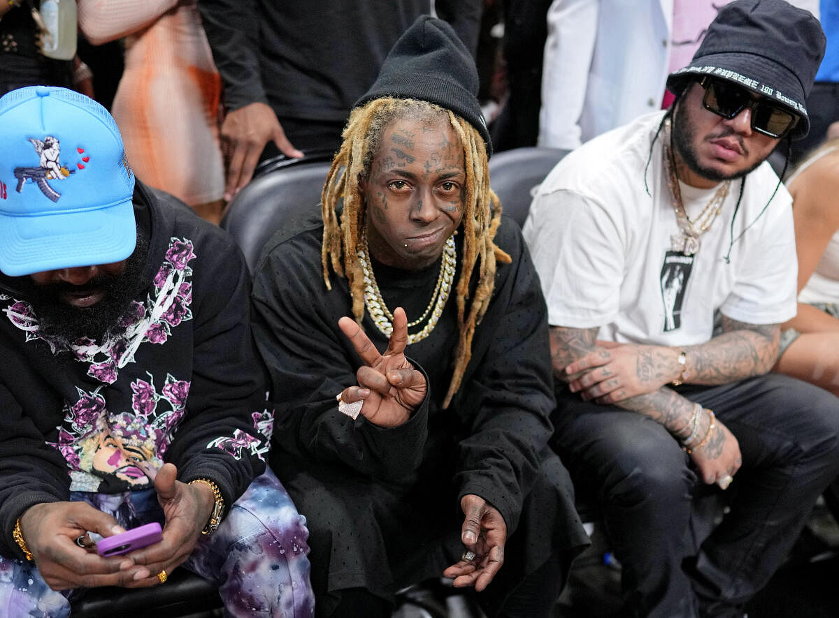 Lil Wayne poses for a photo before game four of the 2023 NBA Finals between the Miami Heat and Denver Nuggets at Kaseya Center. Credit: Reuters Photo
