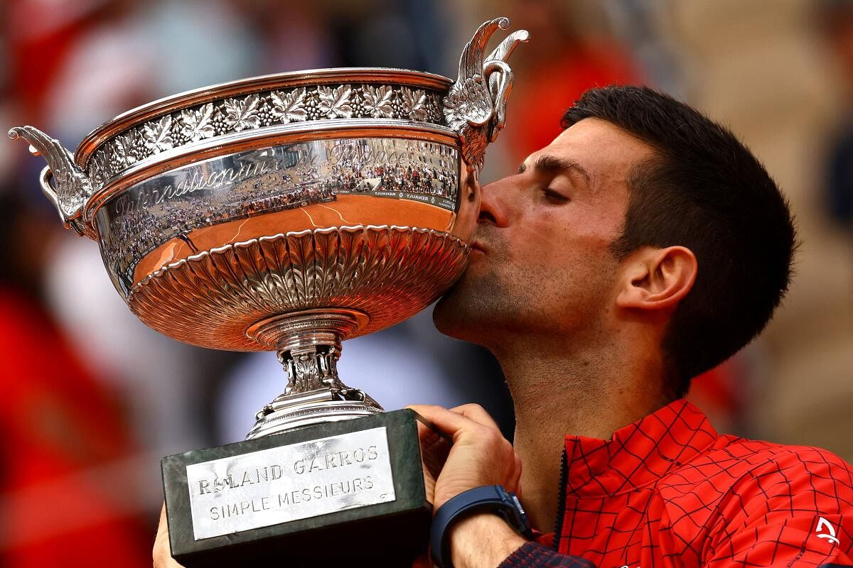 Serbia's Novak Djokovic kisses the trophy after winning the French Open. Credit: Reuters Photo