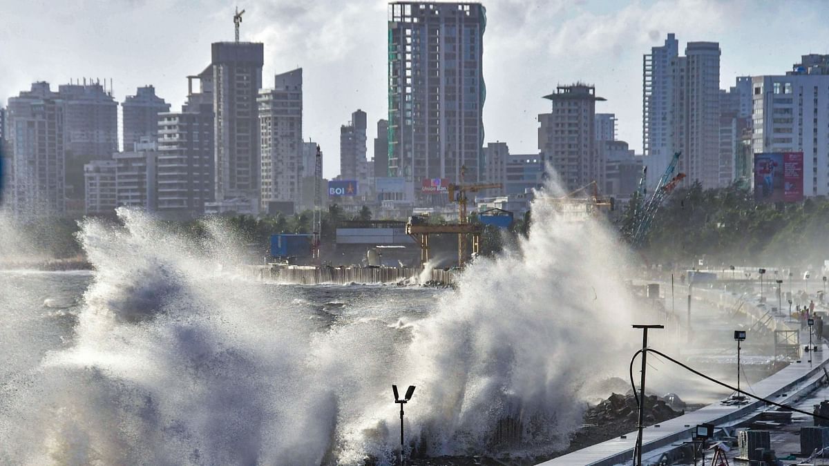 Waves hit the city's waterfront during high tide due to the formation of Cyclone Biparjoy in the Arabian Sea at Marine Drive in Mumbai. Credit: PTI Photo