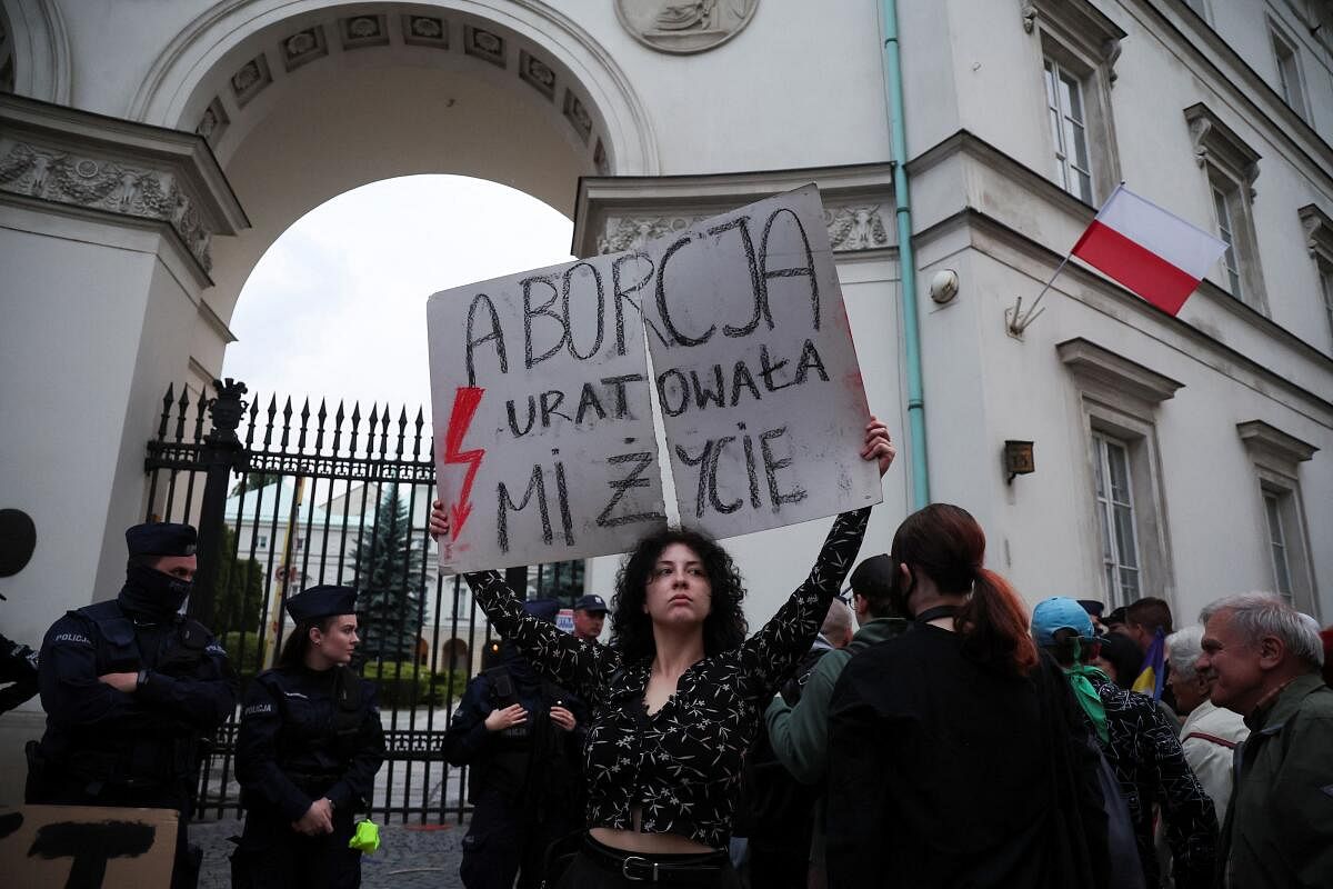 Protest against country's strict anti-abortion laws after a pregnant woman's death in a hospital, in Warsaw, Poland. Credit: reuters Photo