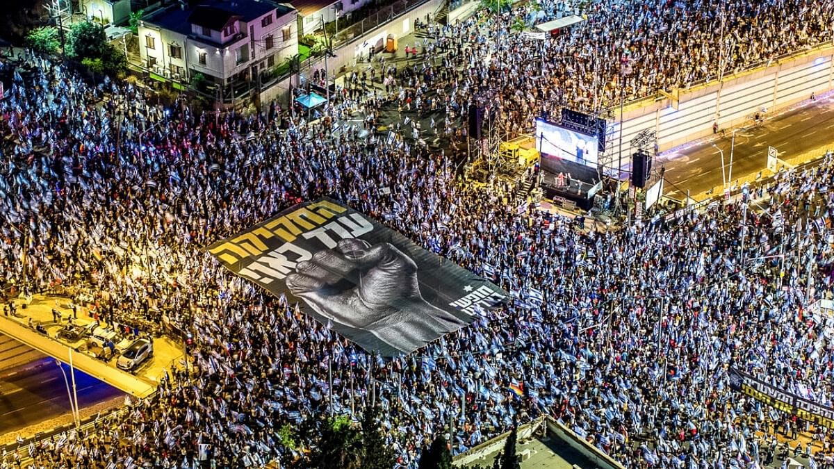 An aerial view shows protesters holding a banner as they take part in a demonstration against Israeli Prime Minister Benjamin Netanyahu and his nationalist coalition government's judicial overhaul, in Tel Aviv, Israel June 17, 2023. Credit: Reuters Photo