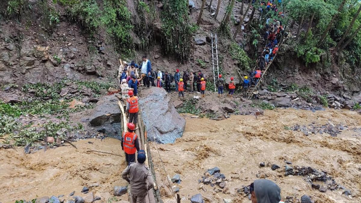Chungthang: Indian Army personnel during a rescue operation after a chunk of road washed away due to heavy rains and landslides that left at least 2400 stranded, in Chungthang, Sikkim, Saturday, June 17, 2023. Credit: PTI Photo