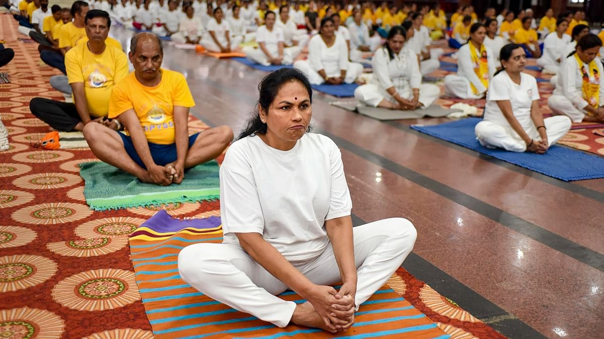 Union Minister Shobha Karandlaje performs yoga during a session on the International Day of Yoga, in Chikmagalur. Credit: PTI Photo